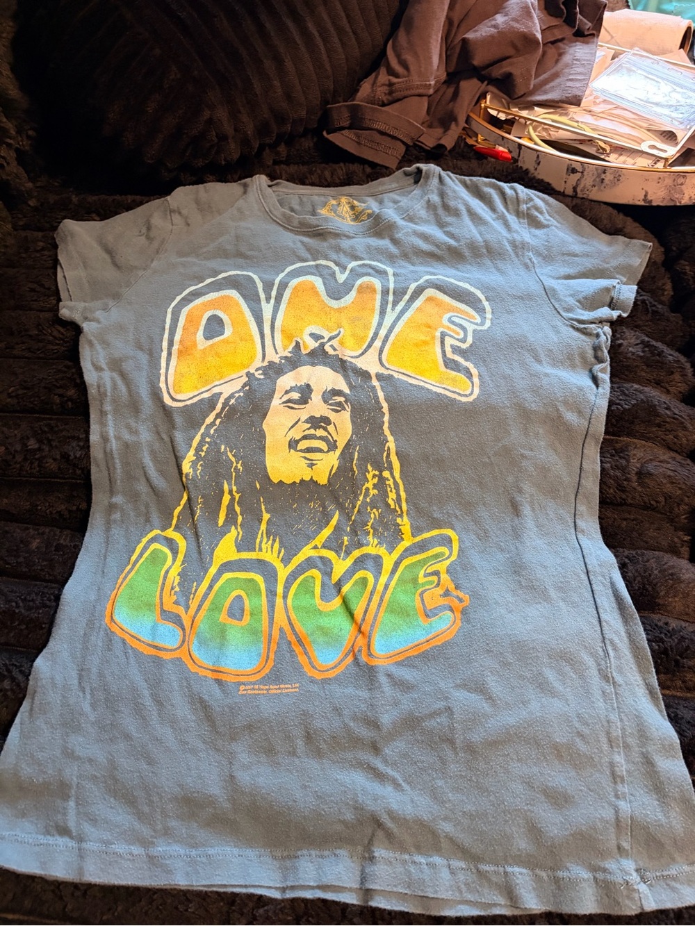 Vintage-Style 'One Love' Graphic Tee in Light Blue with Yellow & Green Print